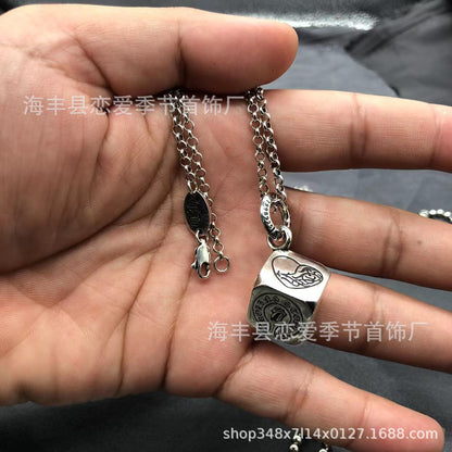 Chrome Hearts heart-shaped sword cross pendant