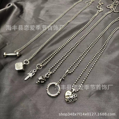 Chrome Hearts heart-shaped sword cross pendant