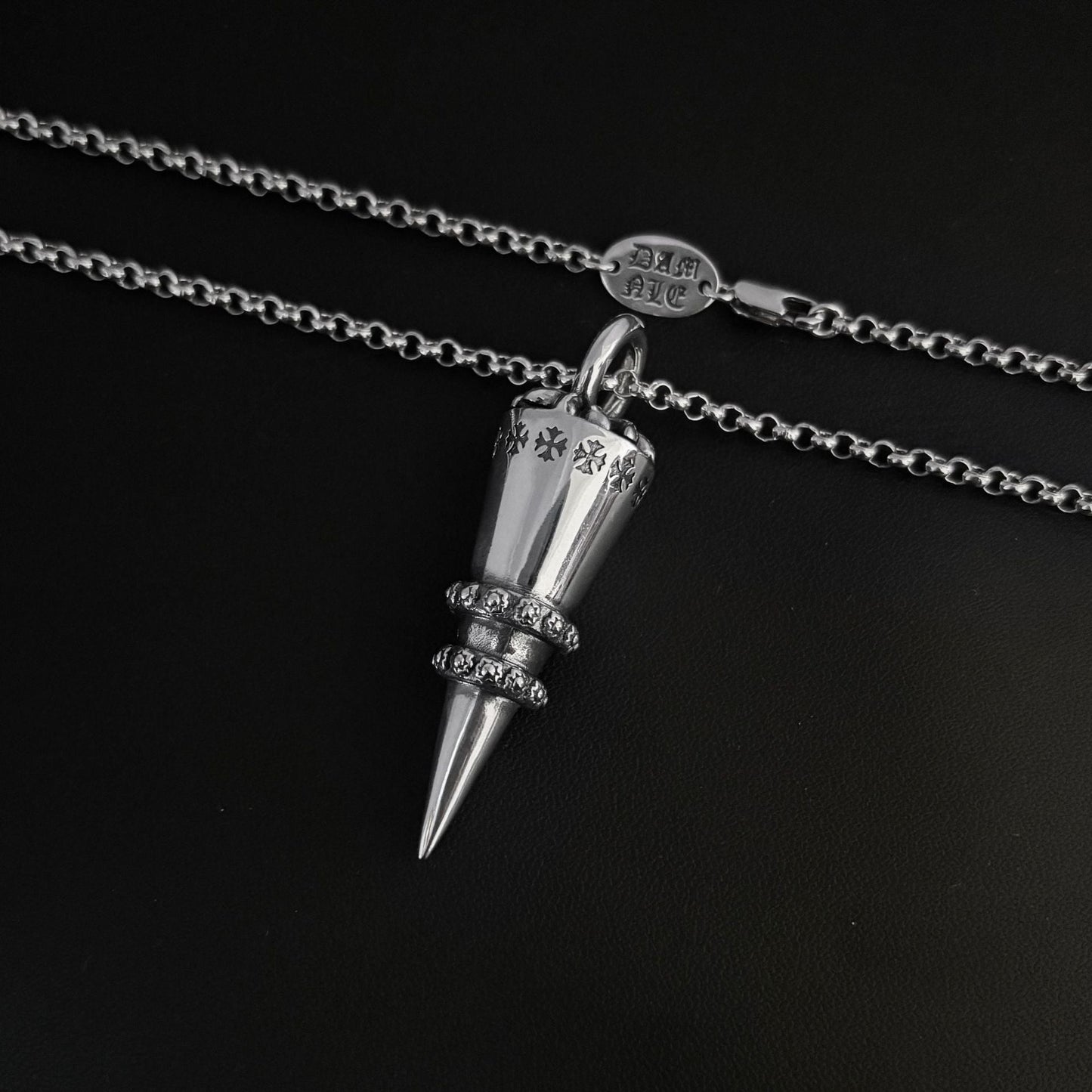 Chrome Hearts distressed cross rivet bullet pendant